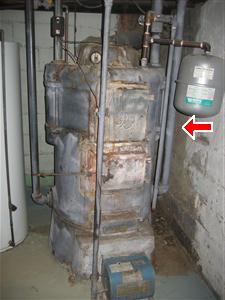 Old Boiler with Asbestos Removed in Basement found by Barrie Home Inspections