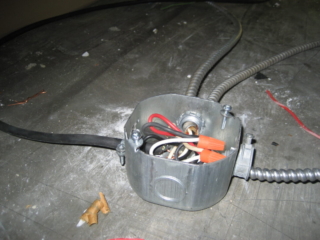 Junction Boxes are required to have Cover Plate and be Secured in place.