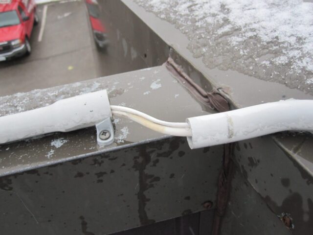 Separated Conduit on Roof Separated conduit on roof cap requires repair.