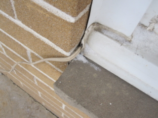Electrical cable is not protected from mechanical harm.   Cable not rated for exterior use.