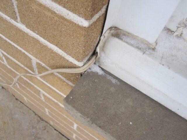 Unprotected Electrical Outet Electrical cable is not protected from mechanical harm. Cable not rated for exterior use.