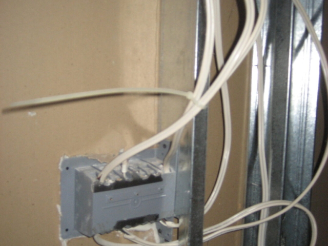 Electrical cables are required to be isolated from metal framing using approved products