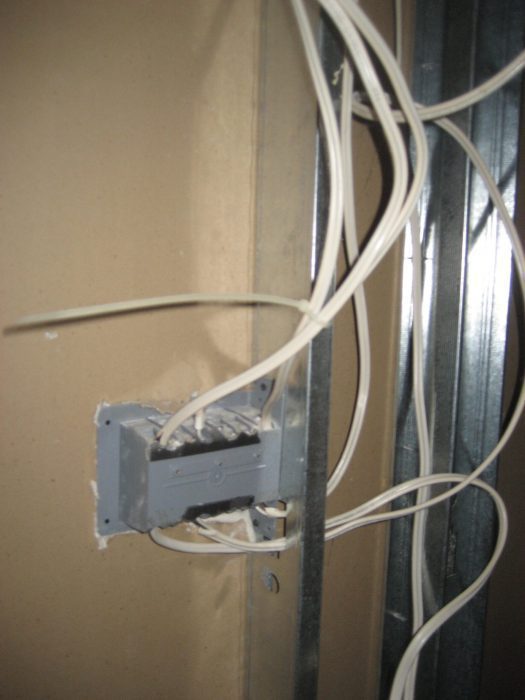 Electrical cables are required to be isolated from metal framing using approved products